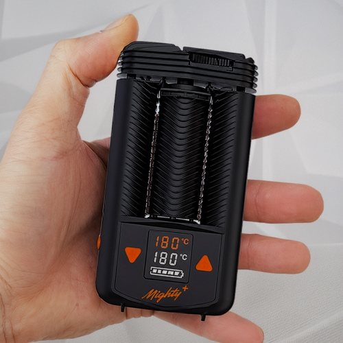 Hand holding a Mighty Plus vaporizer