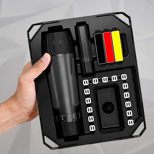 Hand holding a Zeus Arc S Hub kit with the vaporizer, accessories, capsules, and cleaning tools.