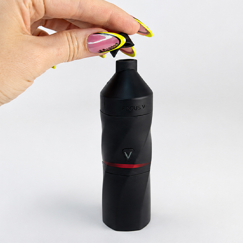 Focus V Aeris is on hand while a woman is attaching its extended mouthpiece.