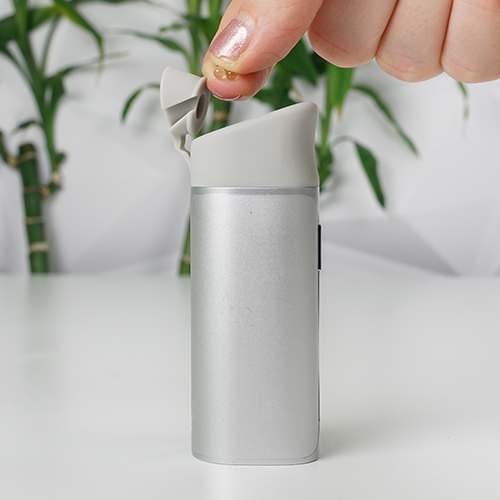 Yocan Black Pocket is on hand while a woman is attaching its extended mouthpiece.