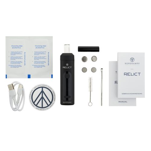 Norddampf Relict vaporizer package contents, including charging cable, cleaning tools, screens, dosing capsules, and user manual