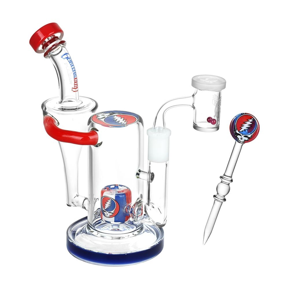 Grateful Dead x Pulsar Honest Tune Recycler Rig with red and blue accents, 14 mm banger, dab tool, and Steal Your Face designs.