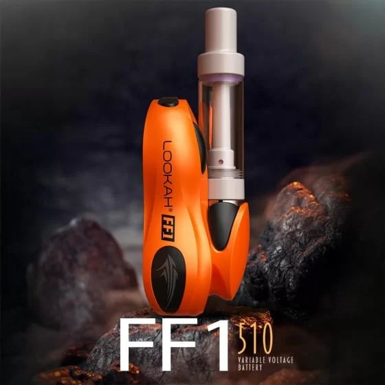 Vibrant orange Lookah FF1 510 thread battery with clear cartridge on dark volcanic background, branding and model text.