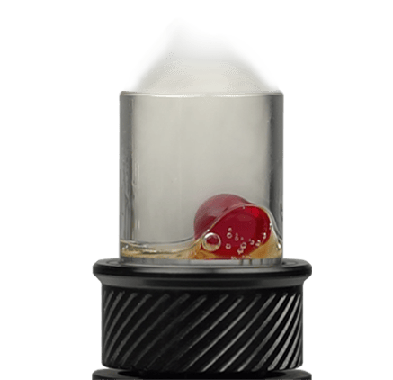 Glass chamber with red terp pearl and concentrate inside vaporizer atomizer